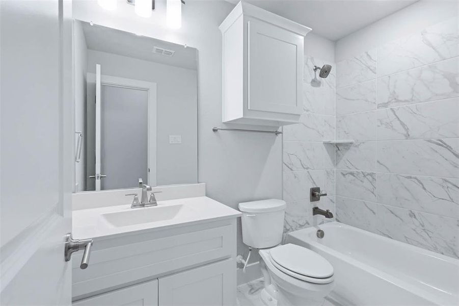 Third upstairs bathroom shared between two secondary bedrooms with convenient access from both rooms.