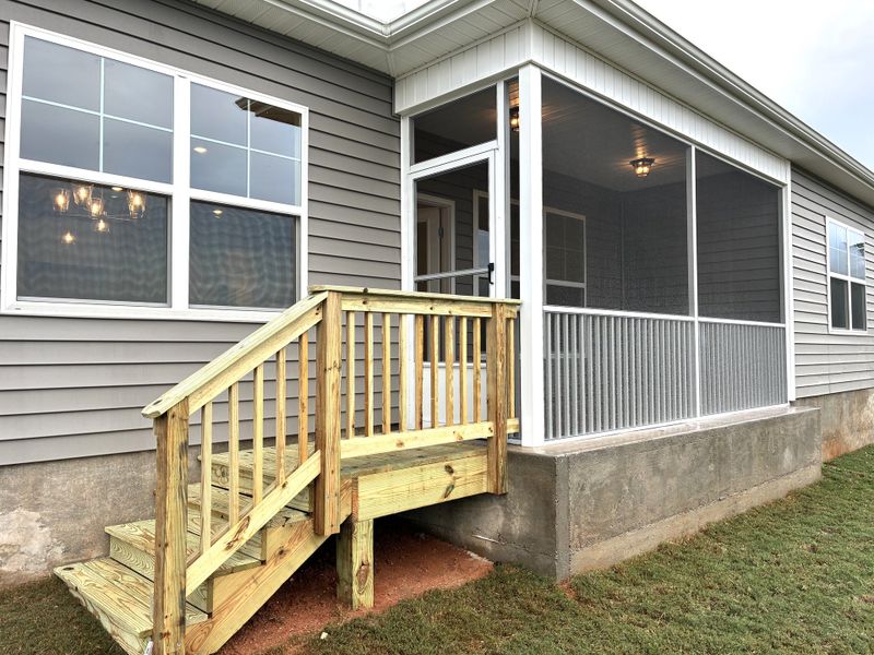 Exterior details and patio area of a home in Holly Ridge, Greenville (Image 14).