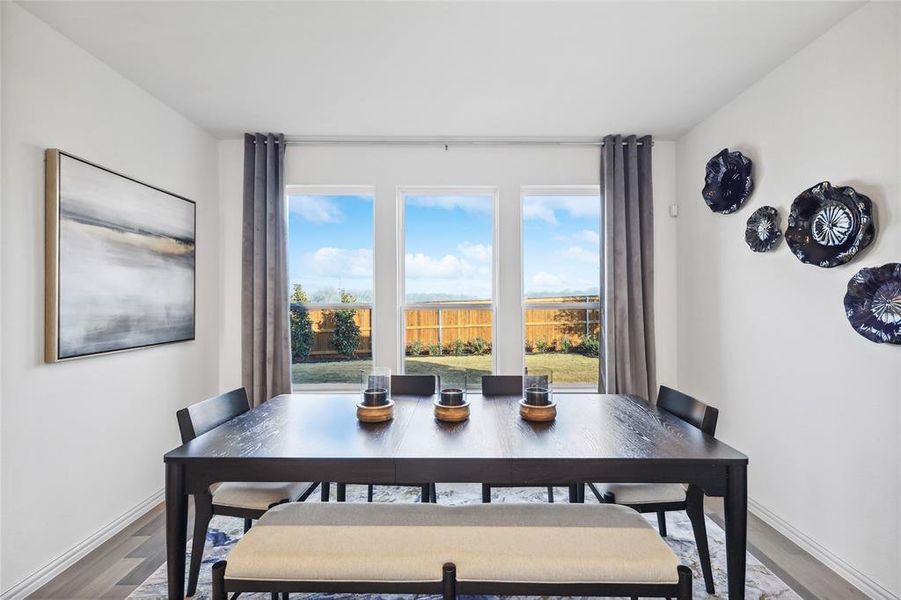 Dining space featuring hardwood / wood-style flooring