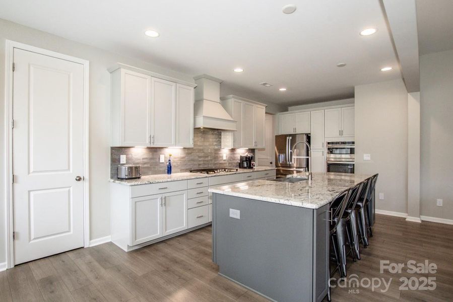 Furnished interior view inside a new home in Signature at Reid's Cove, Mooresville (Image 16).