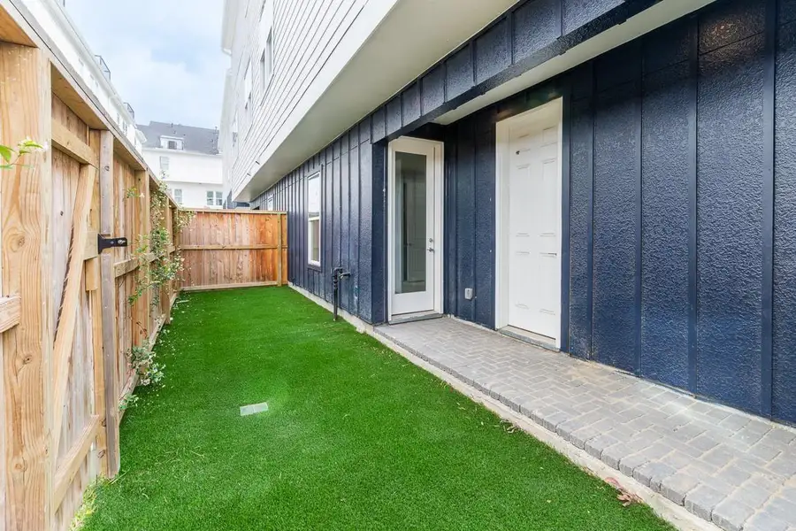 Private back yard space with artificial turf for low maintenance!