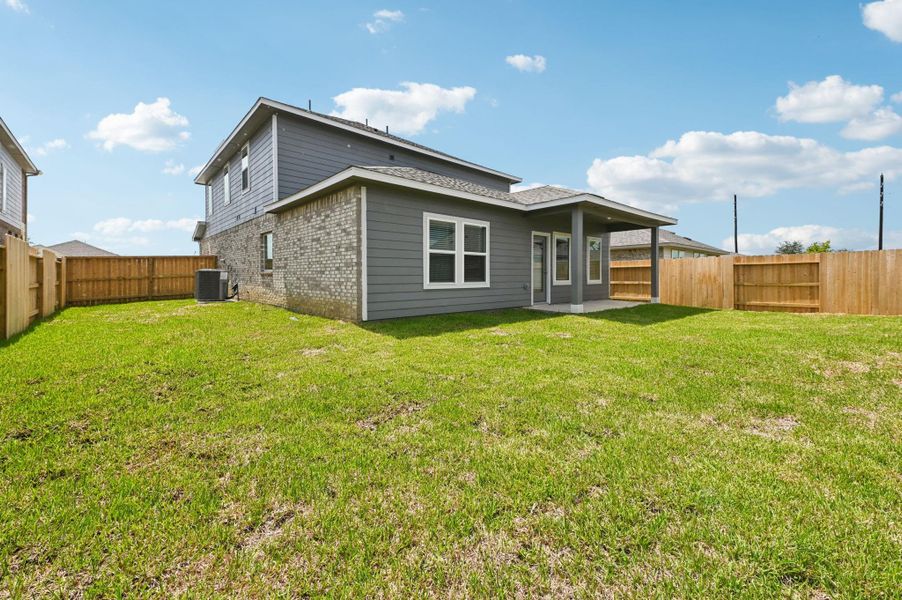 Front exterior of a new home in Heights of Barbers Hill, Mont Belvieu, TX, highlighting curb appeal (Image 2).