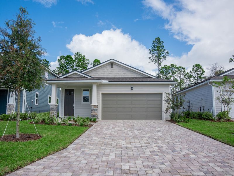 Front exterior of a new home in RiverTown - Forest, St. Johns, FL, highlighting curb appeal (Image 1). Front exterior of a new home in RiverTown - Forest, St. Johns, FL, highlighting curb appeal (Image 1).