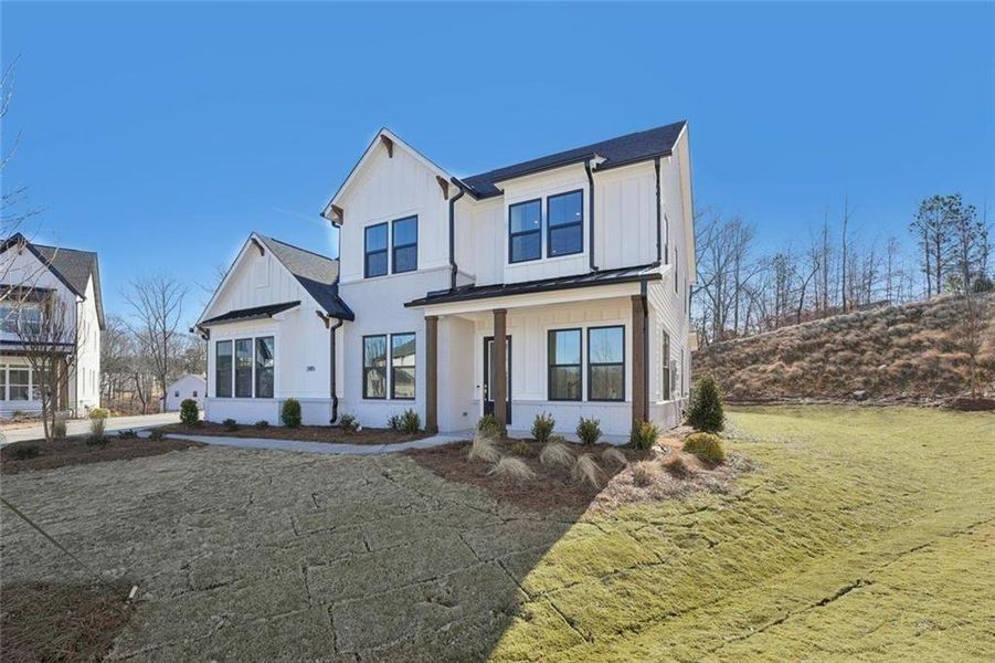 Front exterior of a new home in Sterling Pointe, Cumming, GA, highlighting curb appeal (Image 33).
