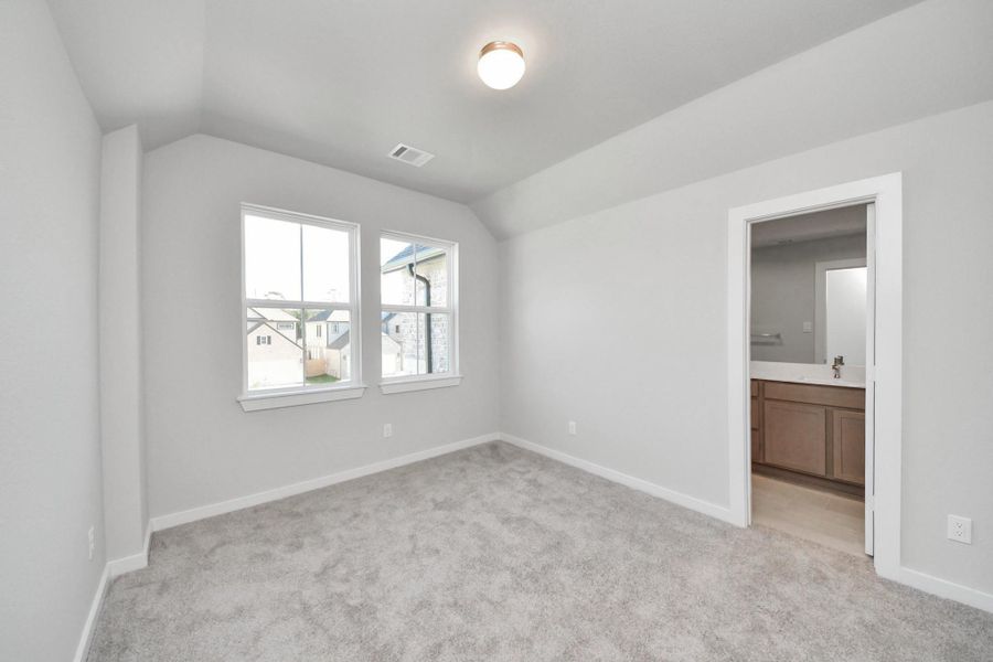 Generously sized secondary bedrooms featuring spacious closets, soft and inviting carpeting underfoot, large windows allowing plenty of natural light, and the added touch of privacy blinds for your personal retreat.