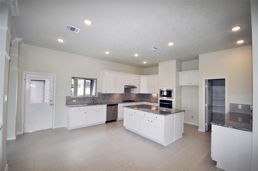 Spacious island kitchen for casual dining and entertaining with family and friends.