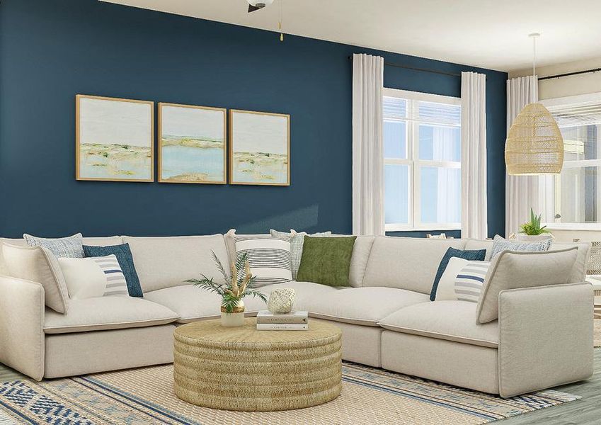 Rendering of living room showing a white  sectional couch, a round coffee table, and decor all along a blue accent wall  and abstract art with a dining set in the background and wood look flooring  throughout.