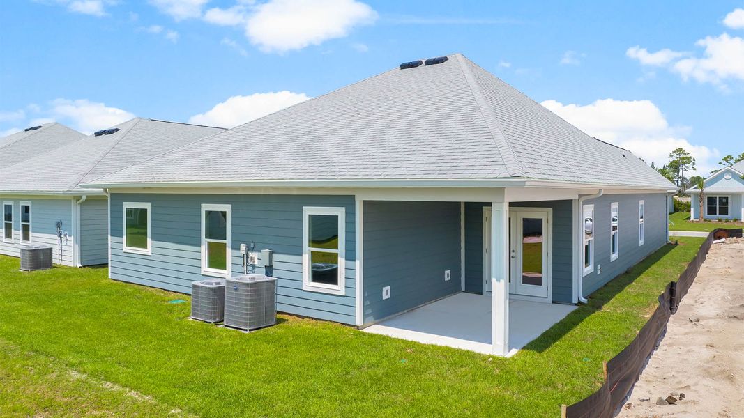 Front exterior of a new home in Windmark Beach, Port Saint Joe, FL, highlighting curb appeal (Image 19). Front exterior of a new home in Windmark Beach, Port Saint Joe, FL, highlighting curb appeal (Image 19).