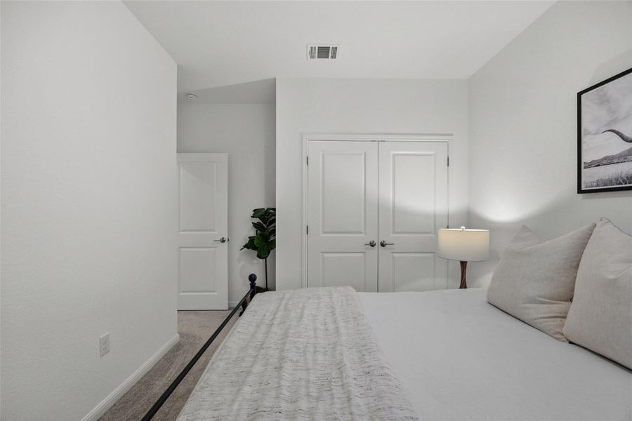 Neutral white wall tones with carpeted flooring