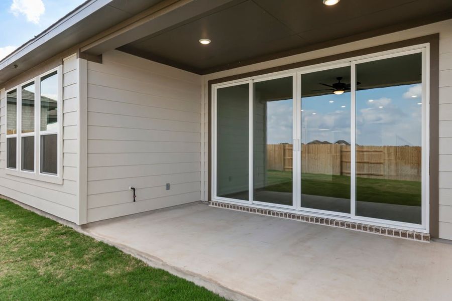Exterior details and patio area of a home in Terrace Collection at Lariat, Liberty Hill (Image 33).