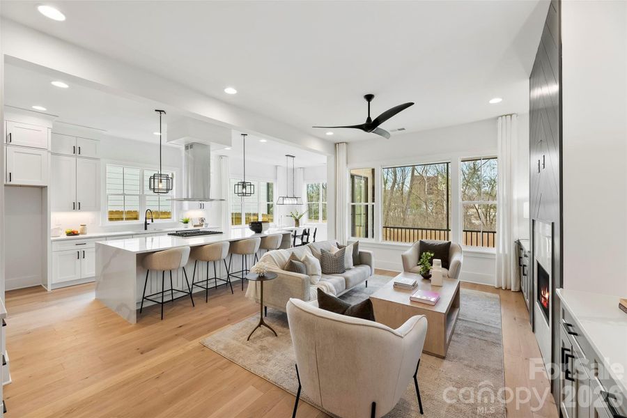 Family Room, Kitchen with oversized waterfall island, breakfast area, and all overlooking the screened in deck Family Room, Kitchen with oversized waterfall island, breakfast area, and all overlooking the screened in deck