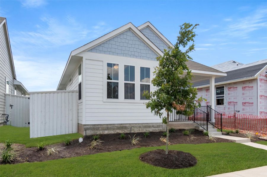 Front exterior of a new home in Casetta Ranch, Kyle, TX, highlighting curb appeal (Image 16).