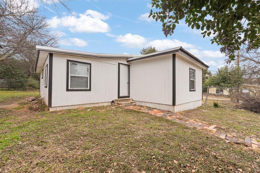 Exterior details and patio area of a home in , Whitney (Image 14). Exterior details and patio area of a home in , Whitney (Image 14).