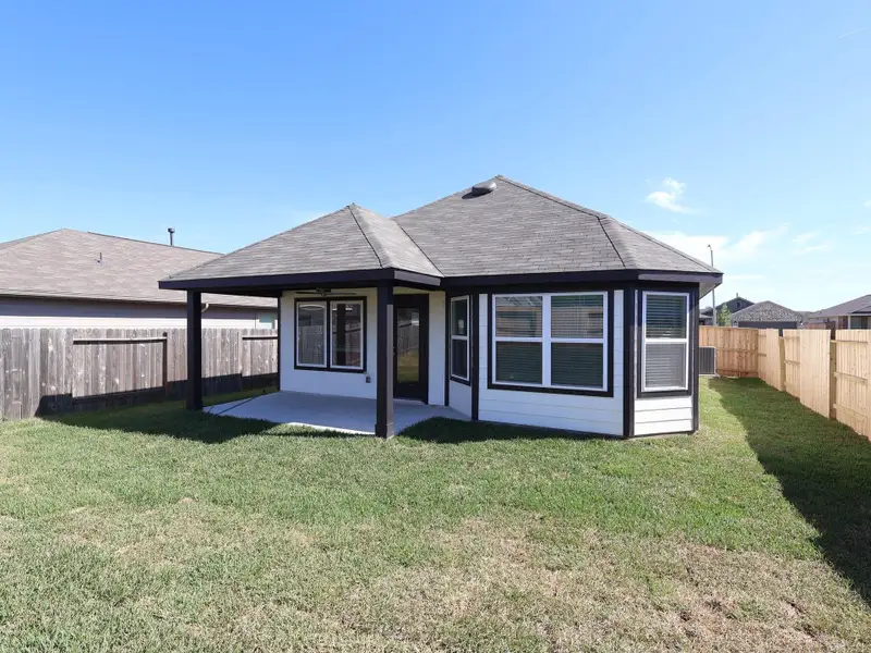 Exterior details and patio area of a home in Magnolia Ridge, Magnolia (Image 3).