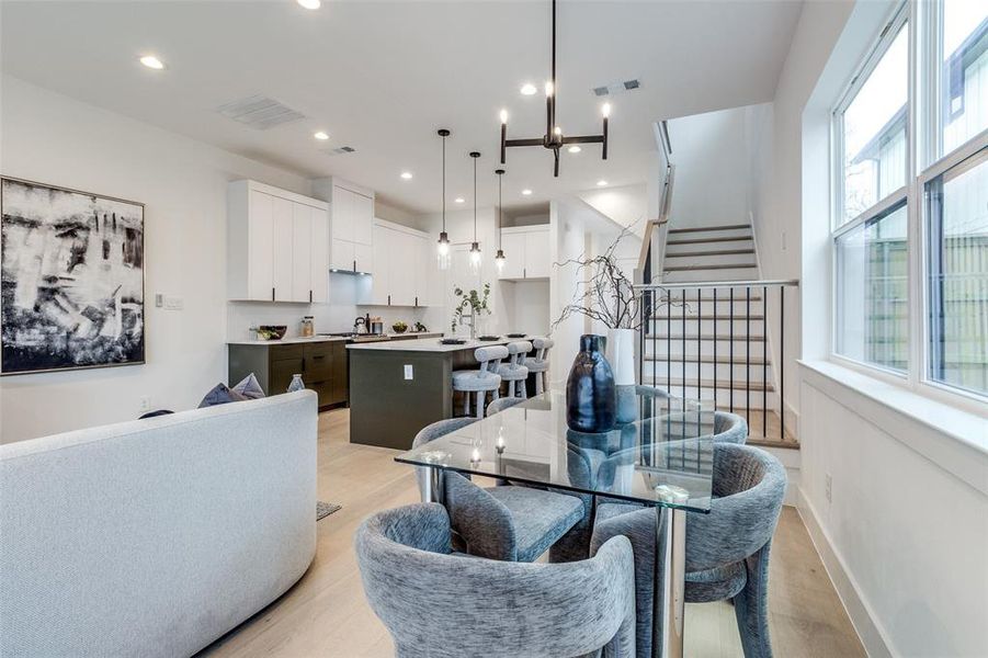 Dining room featuring a chandelier and light hardwood / wood-style flooring