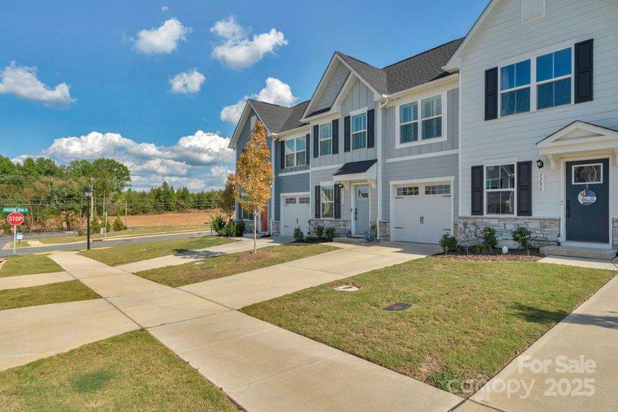 Front exterior of a new home in , Troutman, NC, highlighting curb appeal (Image 18).