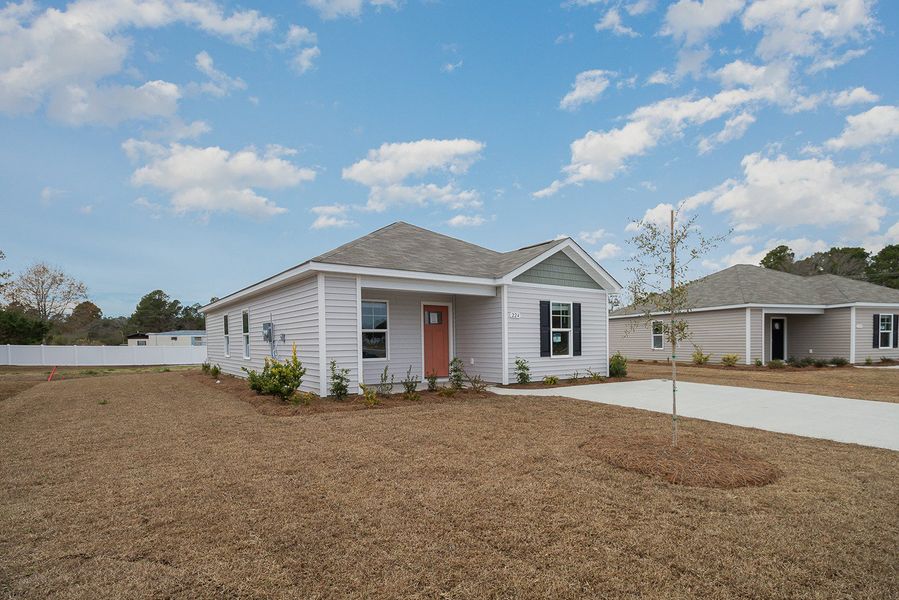 Representative exterior photo of a completed home built from the LEWIS by D.R. Horton in Cottonwood Place, Tabor City, NC (Image 13).