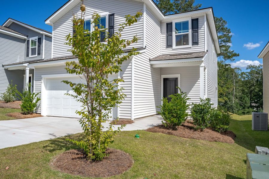 Front exterior of a new home in Grand Arbor, Blythewood, SC, highlighting curb appeal (Image 31).