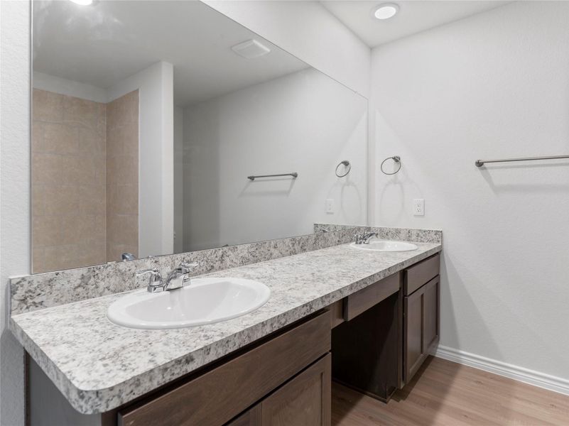 Elegant master bathroom featuring a spacious double-sink vanity. Elegant master bathroom featuring a spacious double-sink vanity.