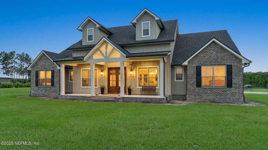 Front exterior of a new home in , Hilliard, FL, highlighting curb appeal (Image 1).