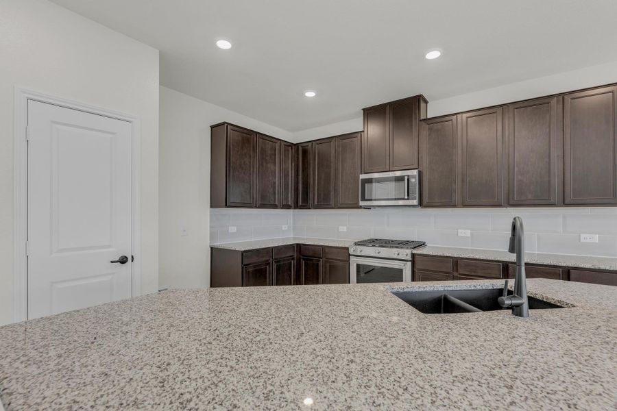 Furnished interior view inside a new home in Salerno - Classic Collection, Round Rock (Image 5). Furnished interior view inside a new home in Salerno - Classic Collection, Round Rock (Image 5).