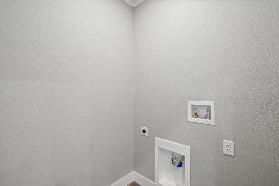 Washroom featuring hookup for an electric dryer and hookup for a washing machine