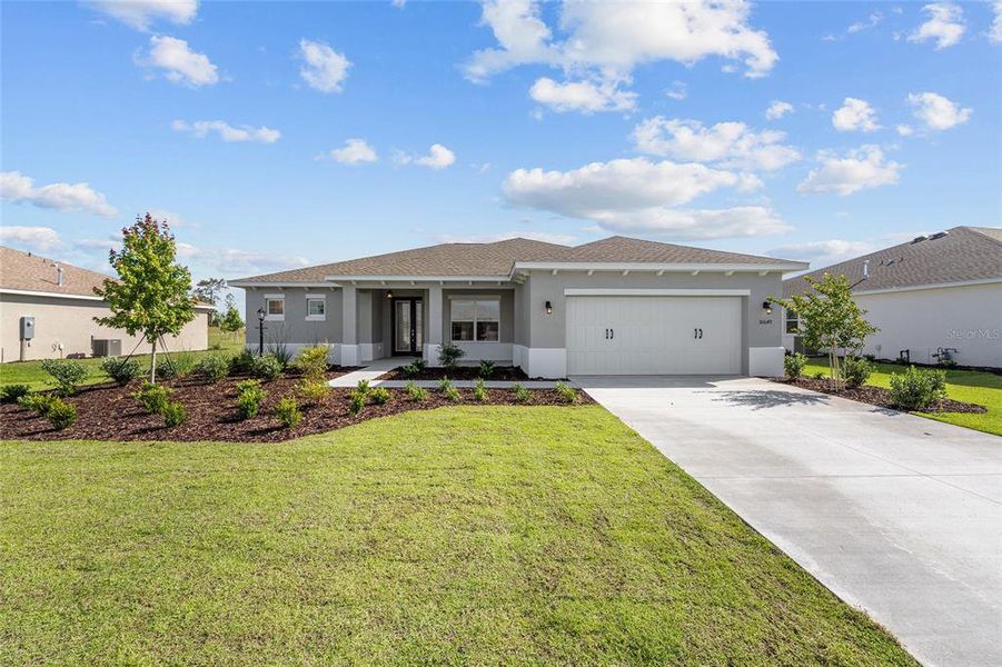 Front exterior of a new home in , Ocala, FL, highlighting curb appeal (Image 18). Front exterior of a new home in , Ocala, FL, highlighting curb appeal (Image 18).