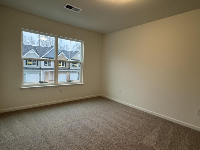 Spacious, unfurnished interior of a new home in East Main Townes, Spartanburg (Image 11).