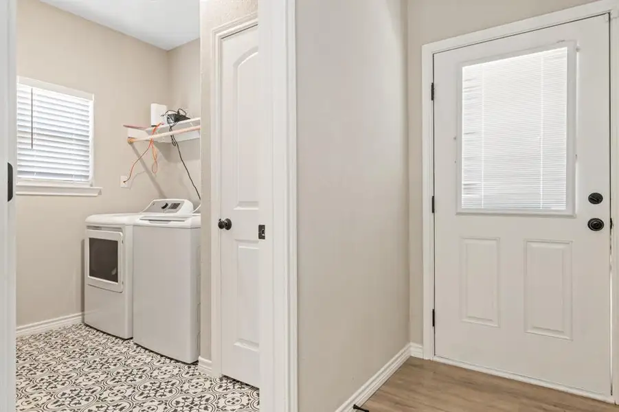 Laundry room near kitchen and side door Laundry room near kitchen and side door