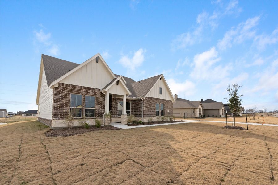 Front exterior of a new home in Fairview Meadows, New Fairview, TX, highlighting curb appeal (Image 23). Front exterior of a new home in Fairview Meadows, New Fairview, TX, highlighting curb appeal (Image 23).