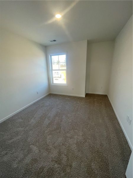 Spacious, unfurnished interior of a new home in Springwood Grove, Central (Image 42).