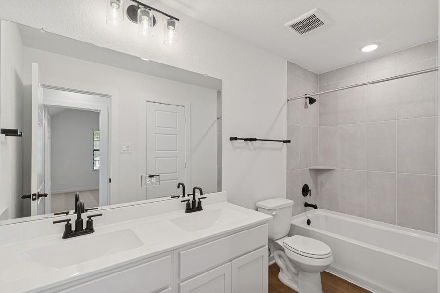 Furnished interior view inside a new home in Lone Star Landing, Montgomery (Image 8).