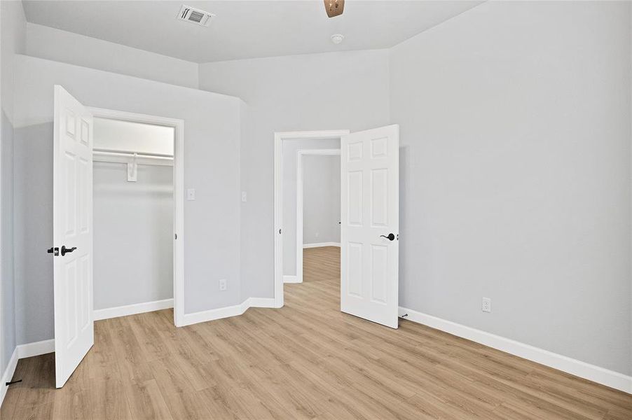 Spare bedroom with ceiling fan and high ceilings!