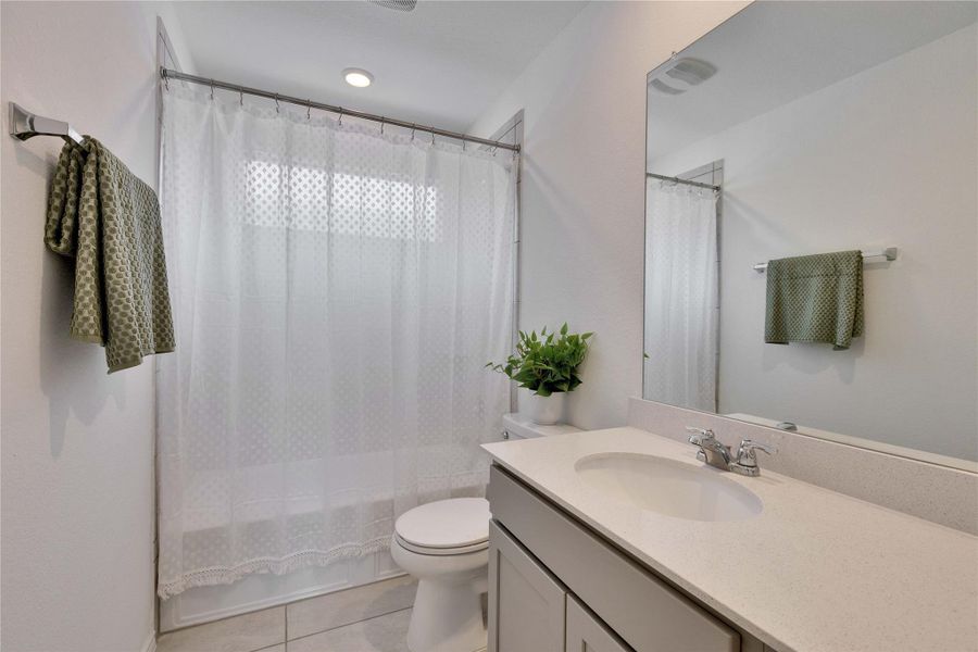 Full bathroom (1 of 2) upstairs. featuring shower / tub combo. Full bathroom (1 of 2) upstairs. featuring shower / tub combo.