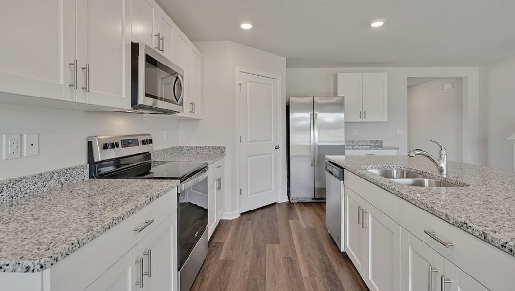 Representative furnished interior of a home built from the HAYDEN by D.R. Horton in Cedar Hill Landing, Navassa (Image 6).