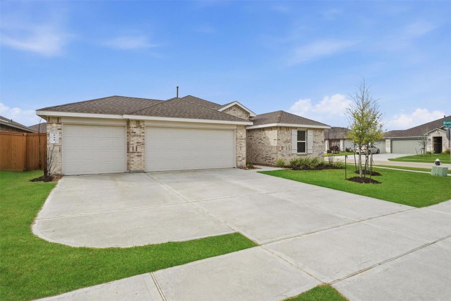 Front exterior of a new home in River Ranch Meadows, Dayton, TX, highlighting curb appeal (Image 1). Front exterior of a new home in River Ranch Meadows, Dayton, TX, highlighting curb appeal (Image 1).
