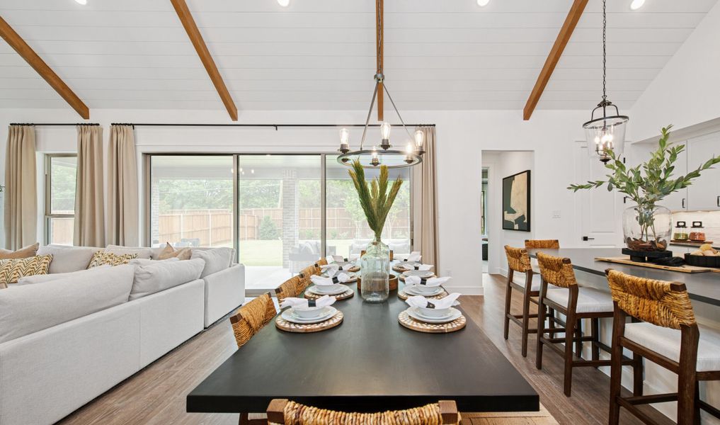 Vaulted ceiling in dining area with chandelier Vaulted ceiling in dining area with chandelier