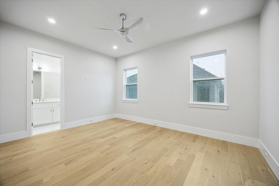 Second bedroom - located on the second floor and has an en-suite bath and a walk-in closet. Second bedroom - located on the second floor and has an en-suite bath and a walk-in closet.