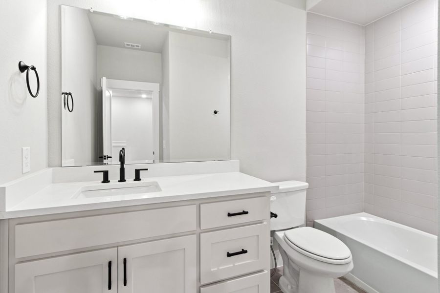 Furnished interior view inside a new home in The Tribute, The Colony (Image 29).