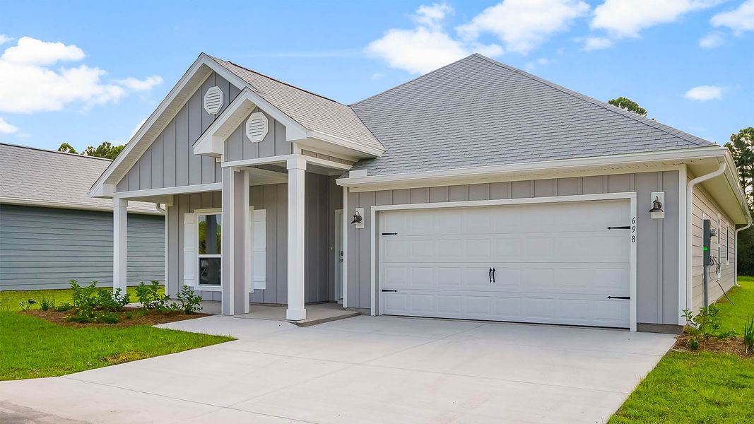 Front exterior of a new home in Buffer Farms, Port Saint Joe, FL, highlighting curb appeal (Image 18).