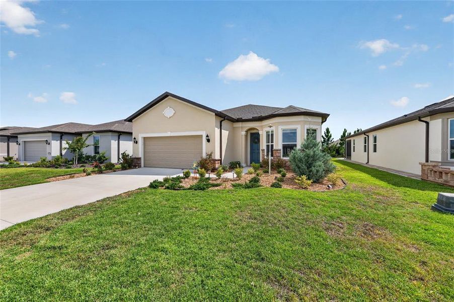 Front exterior of a new home in , Ocala, FL, highlighting curb appeal (Image 2).