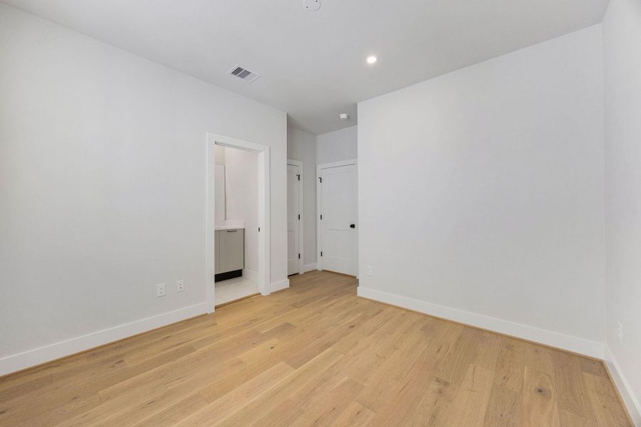 another view of secondary bedroom with convenient access to a private bath.