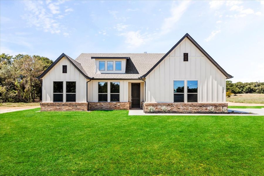 Front exterior of a new home in The Ranches at Valley View, Springtown, TX, highlighting curb appeal (Image 2).
