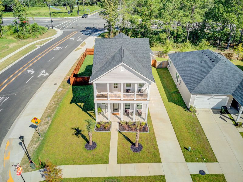 Front exterior of a new home in Limehouse Village: Row Collection, Summerville, SC, highlighting curb appeal (Image 23).