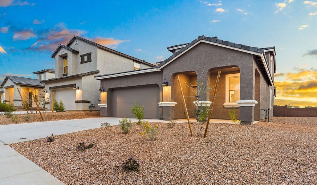 Representative exterior photo of a completed home built from the Juniper by D.R. Horton in The Oasis at Rocking K, Vail, AZ (Image 26).