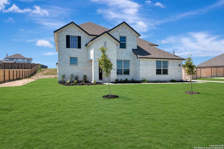 Front exterior of a new home in Everly Estates, San Antonio, TX, highlighting curb appeal (Image 1). Front exterior of a new home in Everly Estates, San Antonio, TX, highlighting curb appeal (Image 1).
