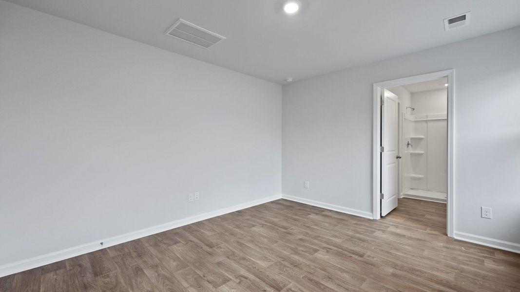 Representative unfurnished interior of a home built from the DOWNING by D.R. Horton in Saltgrass Landing, Winnabow (Image 20).