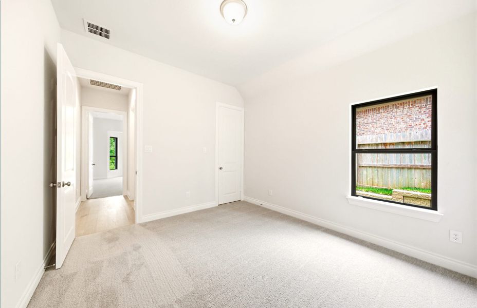 Spacious, unfurnished interior of a new home in The Woodlands Hills 65′, Willis (Image 55).