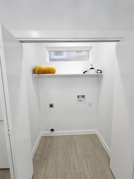 Washroom with washer hookup, light hardwood / wood-style flooring, and electric dryer hookup