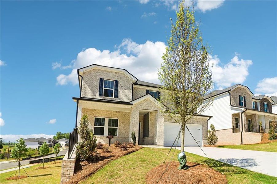 Front exterior of a new home in Harmony Manor, Fairburn, GA, highlighting curb appeal (Image 30). Front exterior of a new home in Harmony Manor, Fairburn, GA, highlighting curb appeal (Image 30).